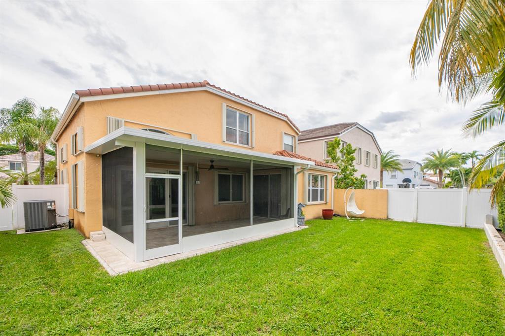 724 Northwest 155th Terrace Pembroke Pines, FL 33028 - Photo 42 of 46 a view of a house with a yard and a garden