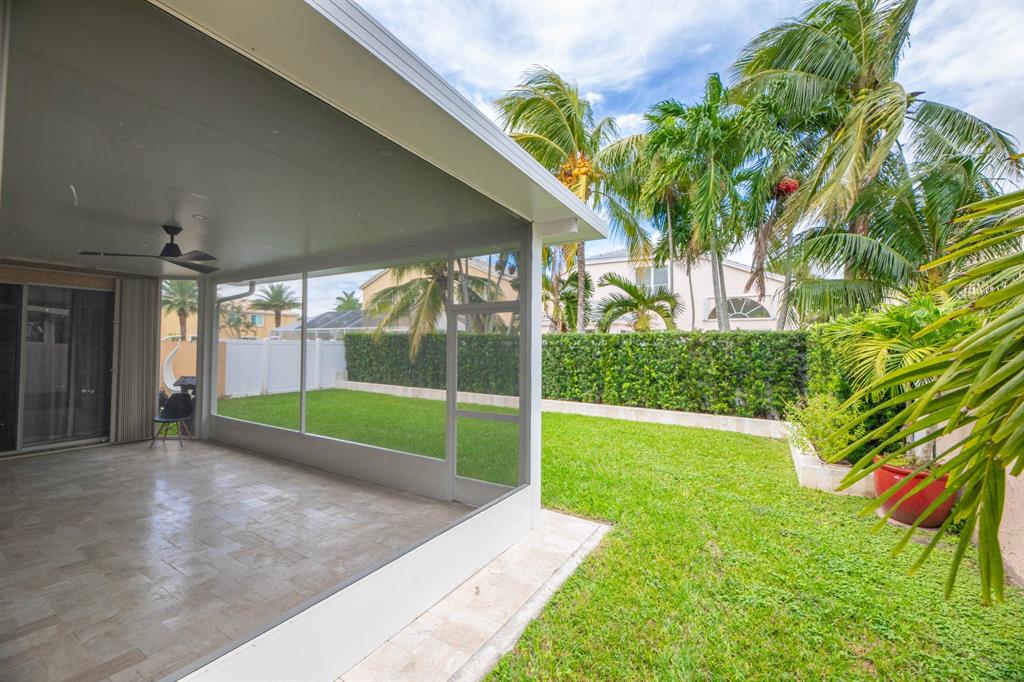 724 Northwest 155th Terrace Pembroke Pines, FL 33028 - Photo 45 of 46 a view of a backyard with a garden