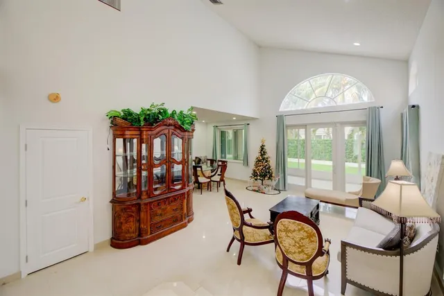 a view of a livingroom with furniture and a potted plant