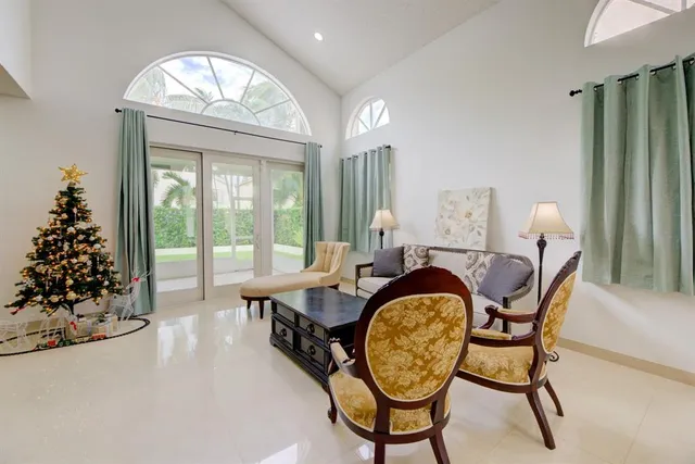 a very nice looking room with a large window and dining table