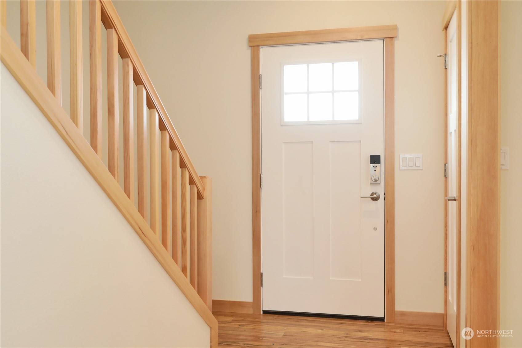 5015 Eagle Ridge Drive Freeland, WA 98249 - Photo 16 of 28 a view of a hallway with wooden floor and staircase