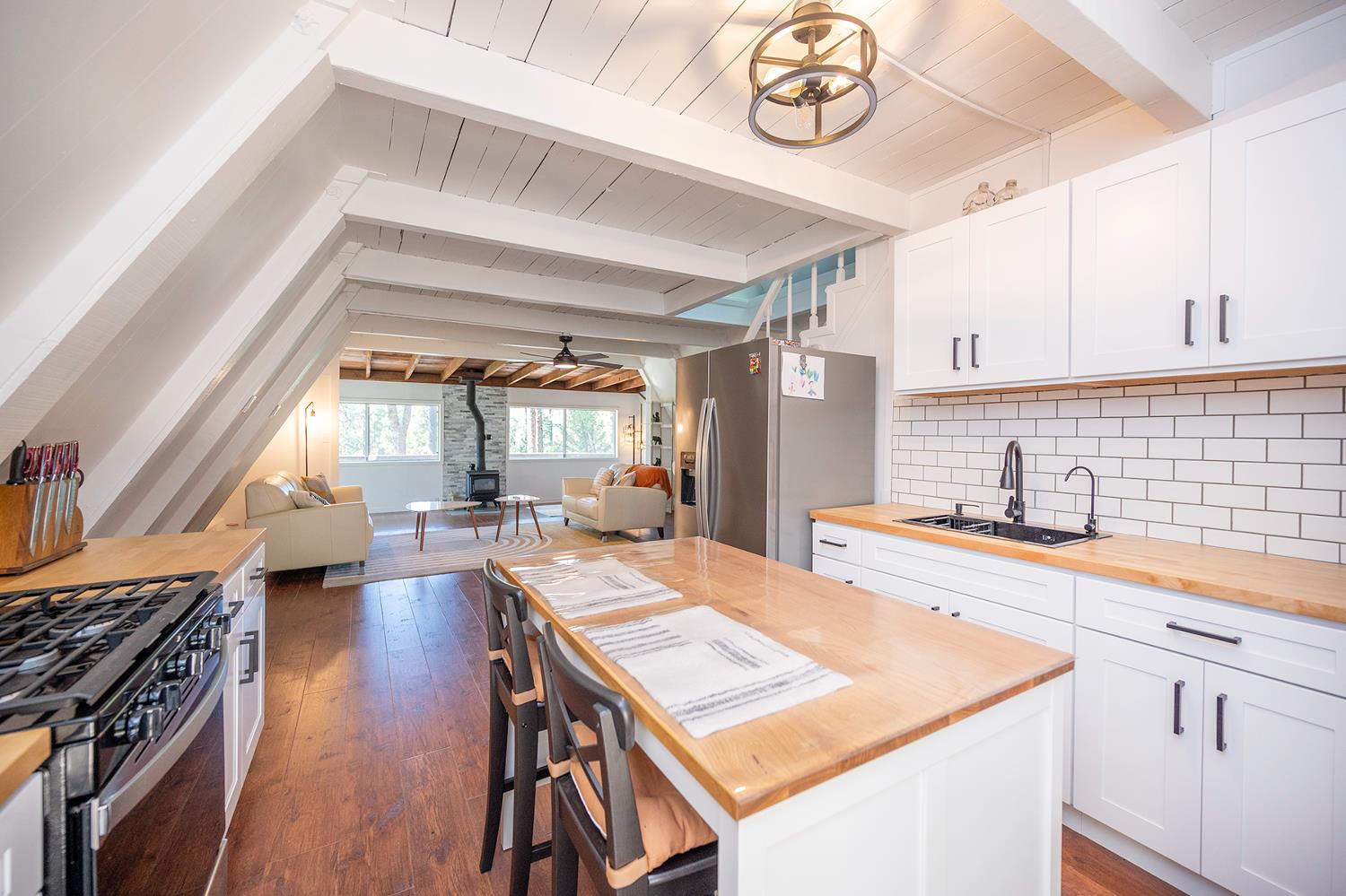 6141 Sweeney Road Somerset, CA 95684 - Photo 25 of 67 a kitchen with a stove a sink and a refrigerator