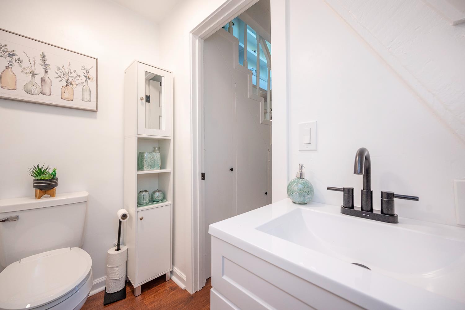 6141 Sweeney Road Somerset, CA 95684 - Photo 30 of 67 a bathroom with a sink vanity mirror and toilet