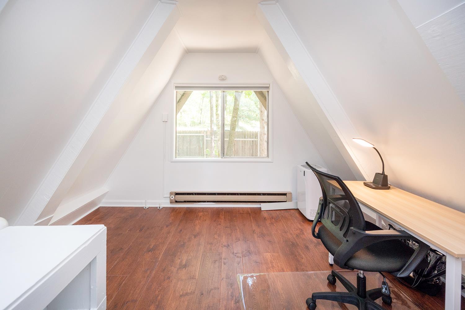 6141 Sweeney Road Somerset, CA 95684 - Photo 40 of 67 a view of an empty room with wooden floor and a window