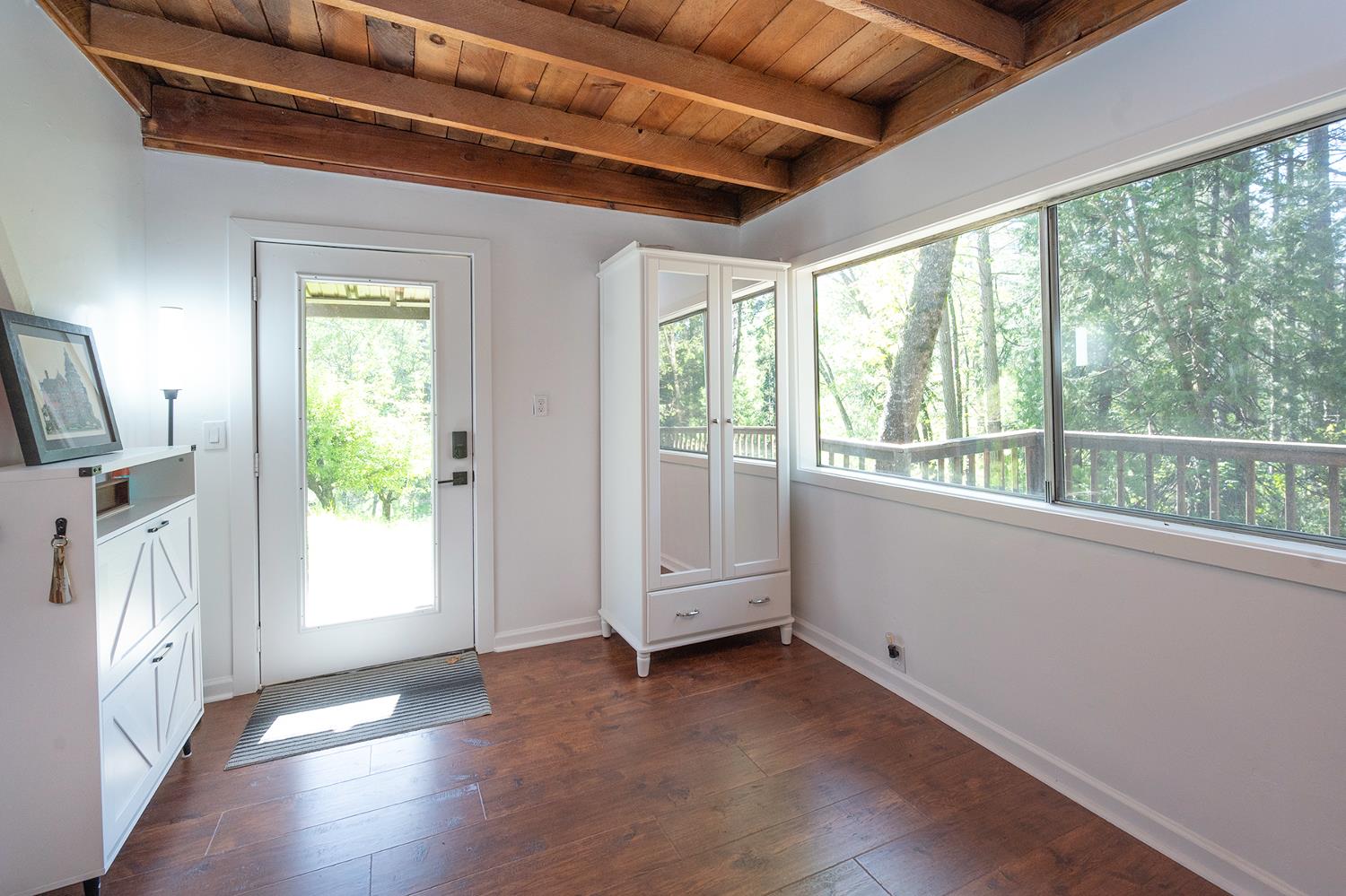 6141 Sweeney Road Somerset, CA 95684 - Photo 7 of 67 a view of empty room with wooden floor and fan