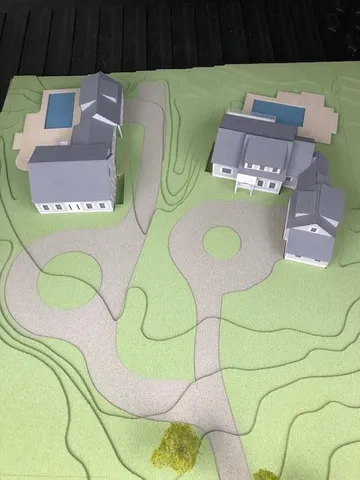 a aerial view of a swimming pool with outdoor seating