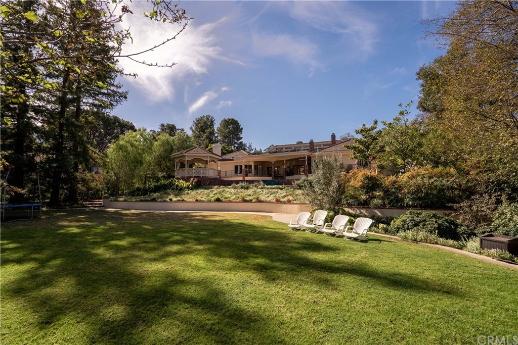 Hard to find sprawling one story custom home on private parklike grounds with mountain views.