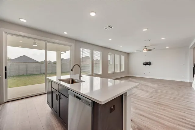a view of a house with a yard and sitting area