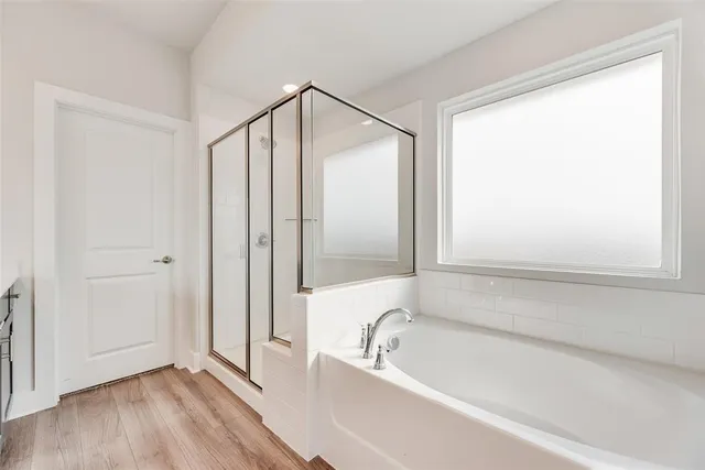 a bathroom with a sink a mirror and a shower