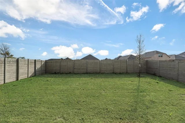 a view of a back yard from a balcony
