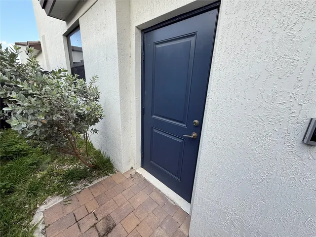 a view of house with backyard