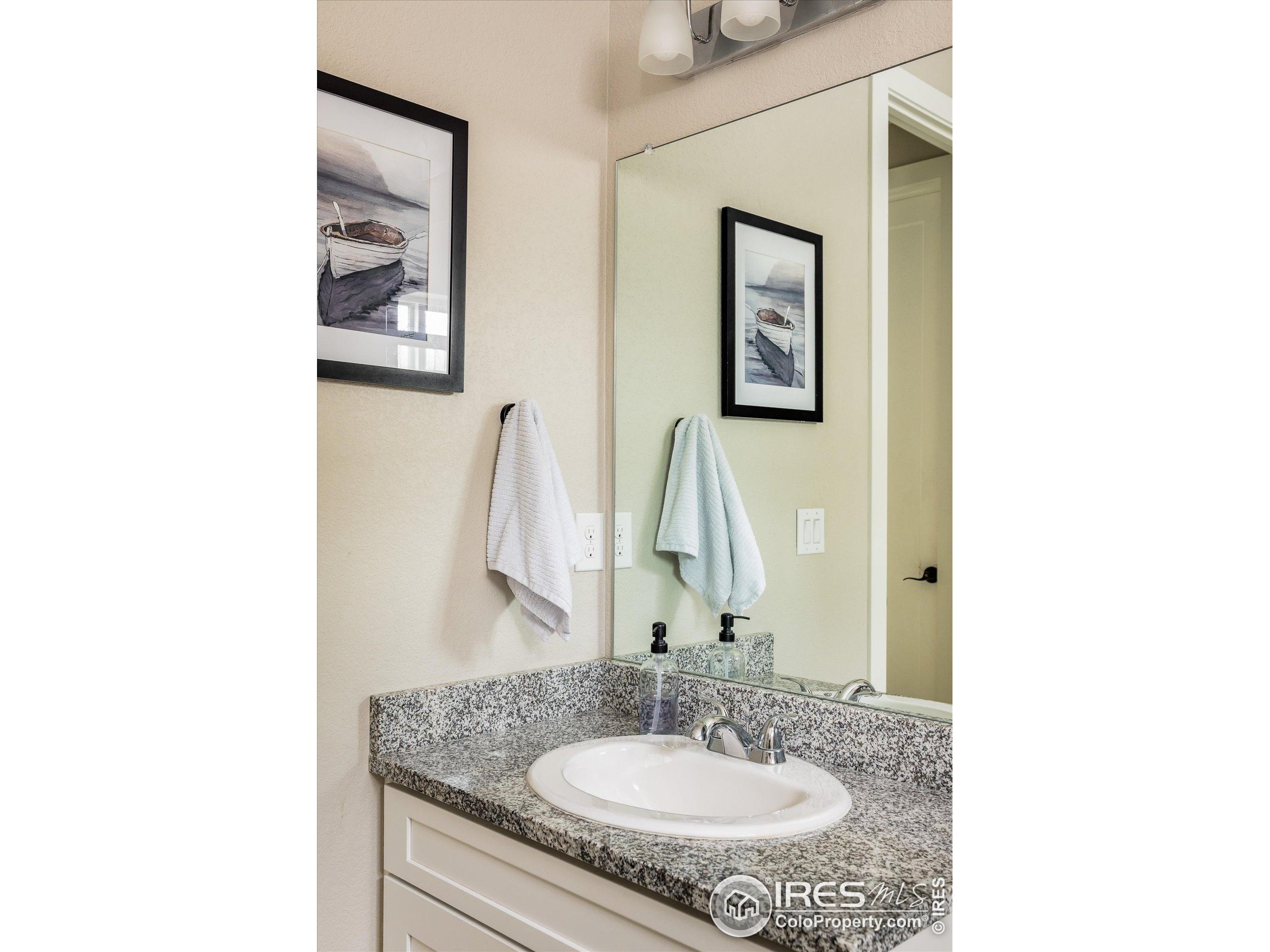 10121 Flower Street Westminster, CO 80021 - Photo 17 of 40 a bathroom with a sink and a mirror