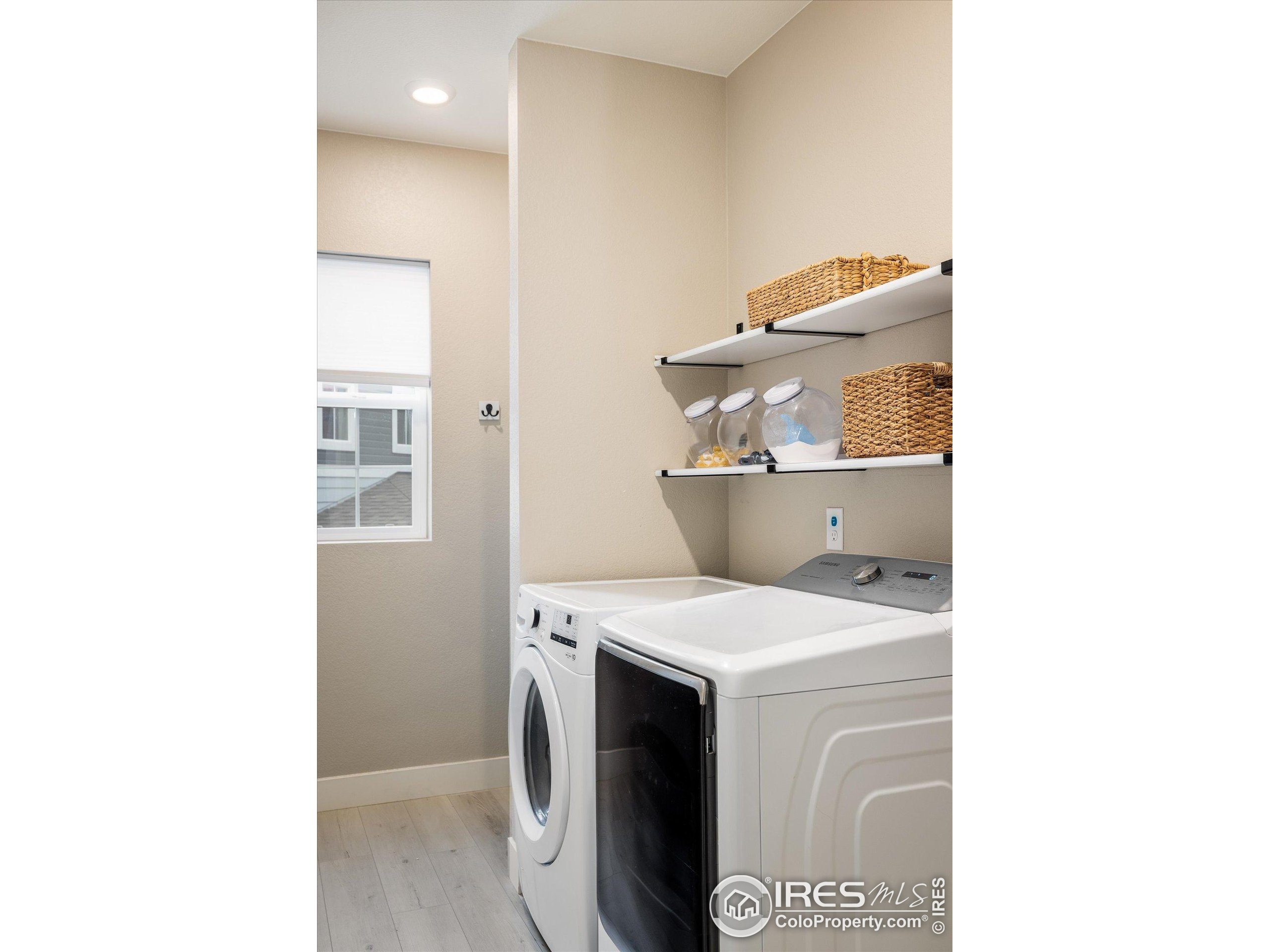 10121 Flower Street Westminster, CO 80021 - Photo 27 of 40 a utility room with dryer and washer