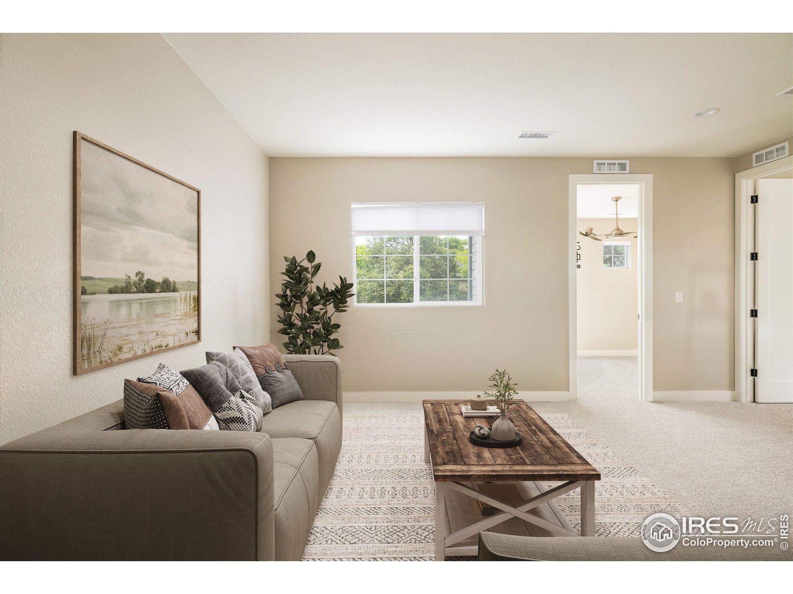 10121 Flower Street Westminster, CO 80021 - Photo 29 of 40 a living room with furniture and a window