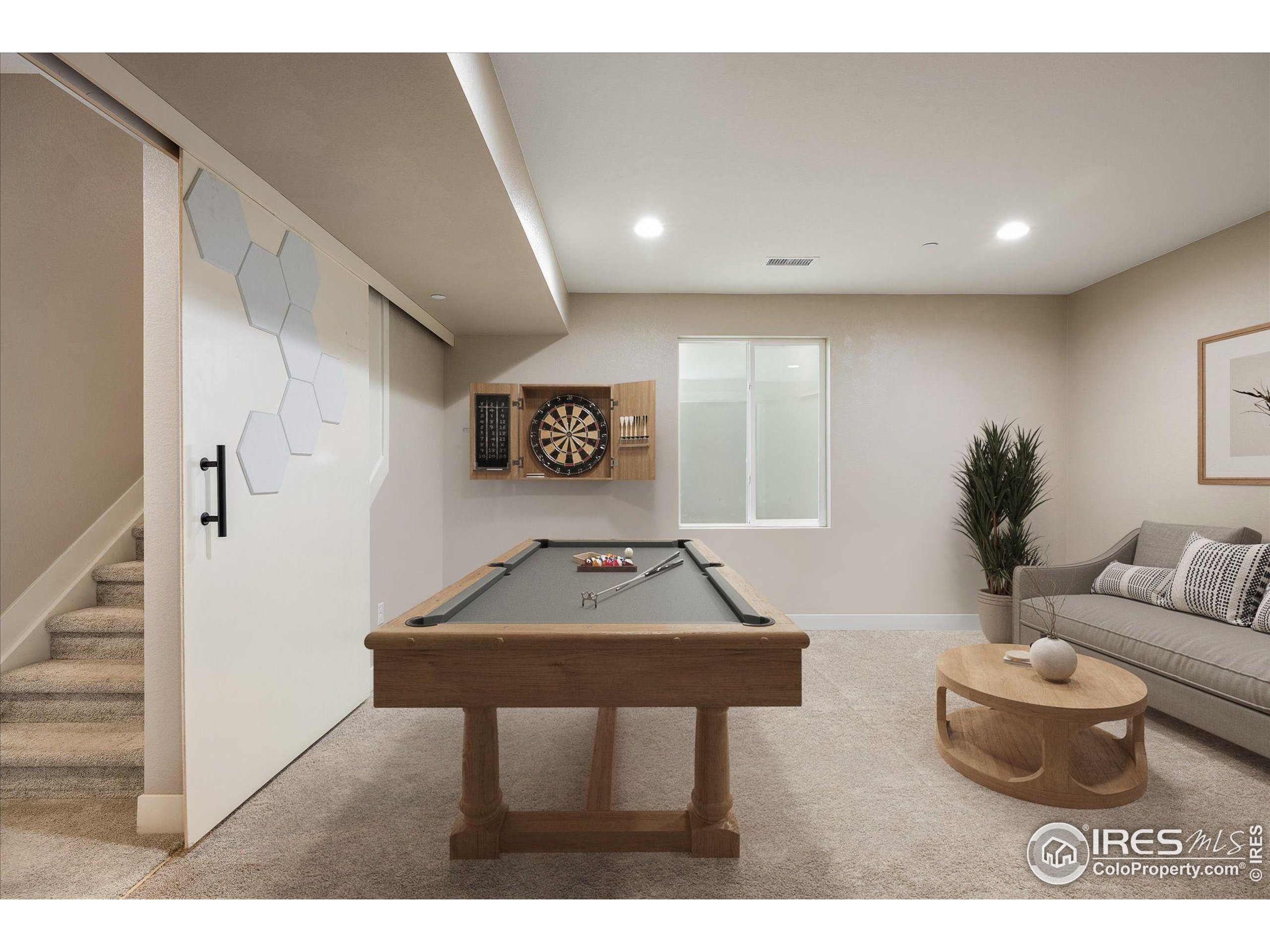 10121 Flower Street Westminster, CO 80021 - Photo 31 of 40 a living room with furniture and a potted plant