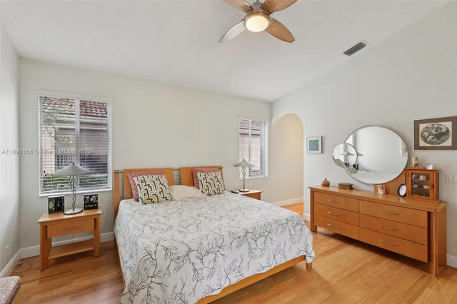 a bedroom with a bed and a view of bedroom