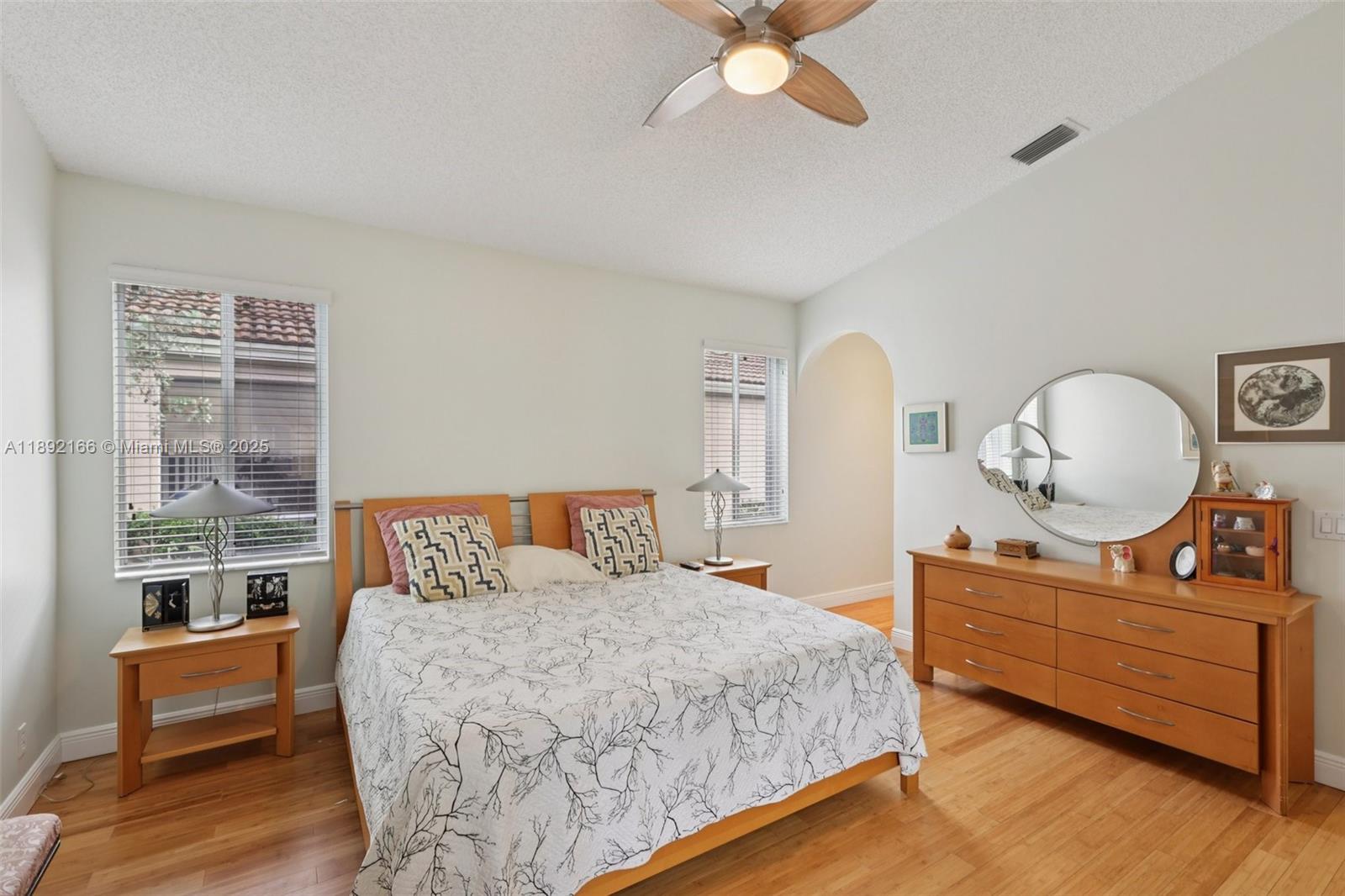 8752 Northwest 75th Court Tamarac, FL 33321 - Photo 14 of 26 a bedroom with a bed and window