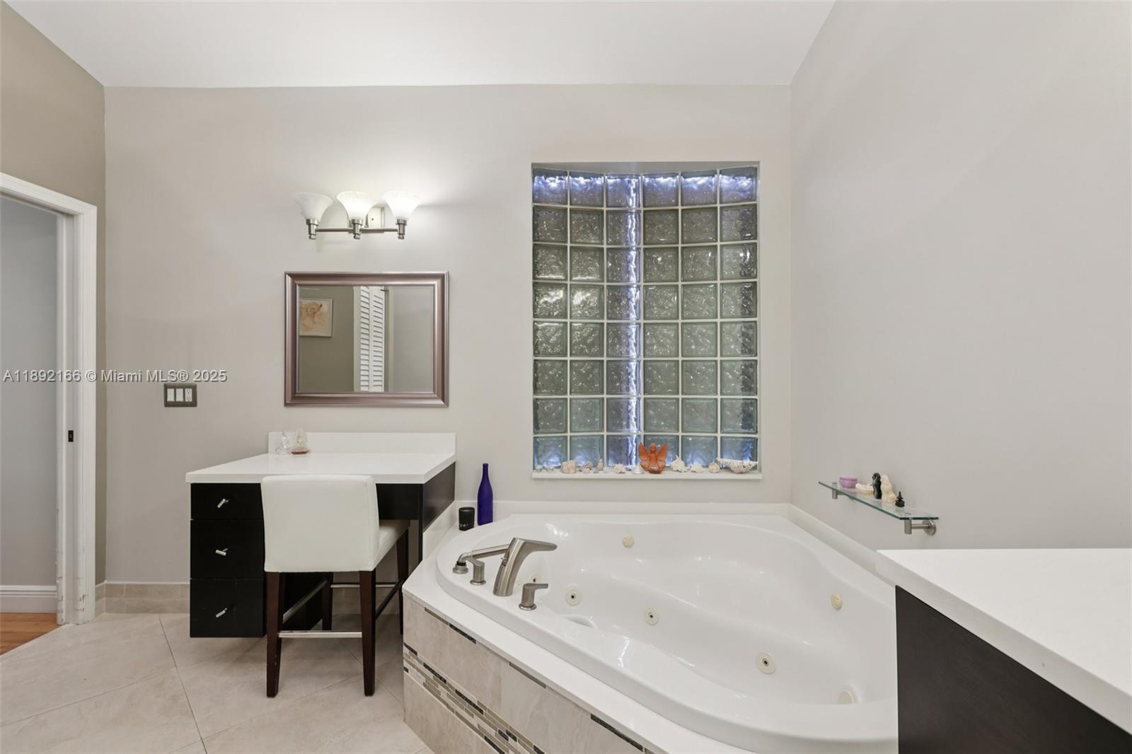 8752 Northwest 75th Court Tamarac, FL 33321 - Photo 17 of 26 a bathroom with a bathtub sink and toilet