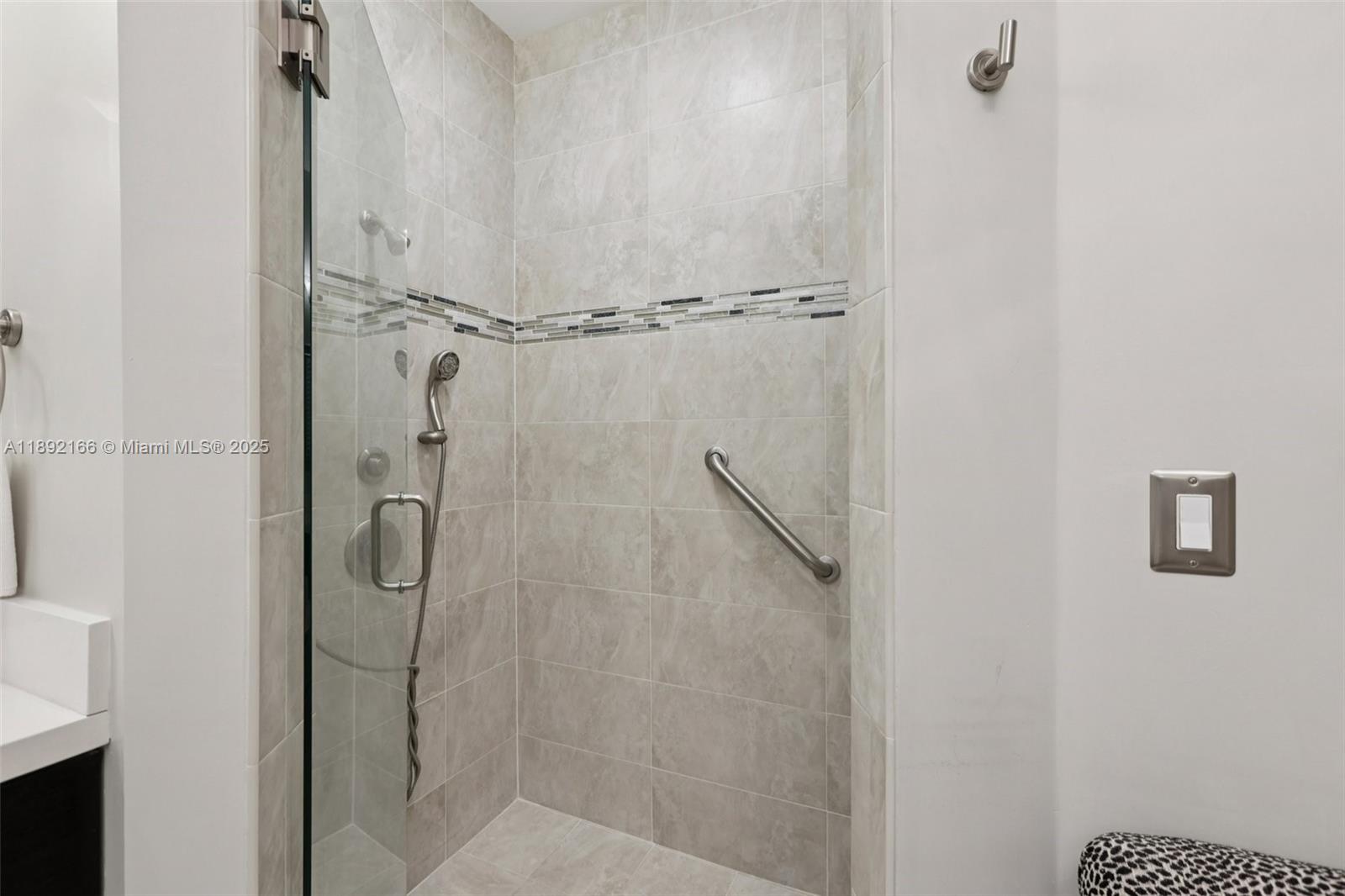8752 Northwest 75th Court Tamarac, FL 33321 - Photo 18 of 26 a bathroom with a shower