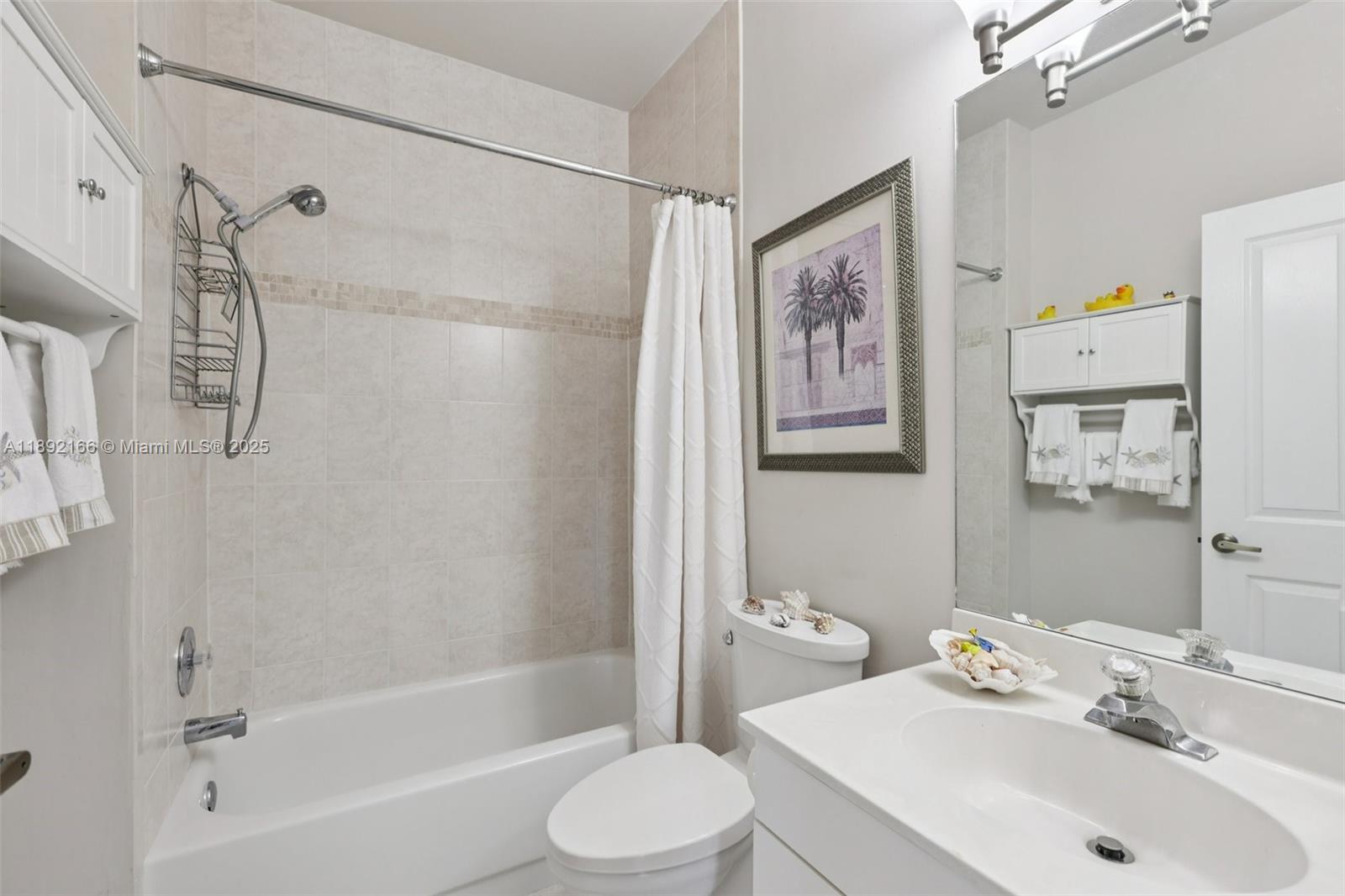 8752 Northwest 75th Court Tamarac, FL 33321 - Photo 20 of 26 a bathroom with a sink toilet and shower