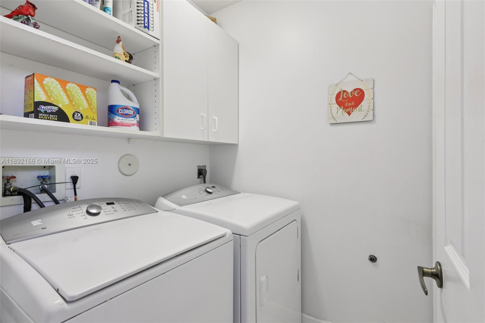 8752 Northwest 75th Court Tamarac, FL 33321 - Photo 23 of 26 a utility room with dryer and washer