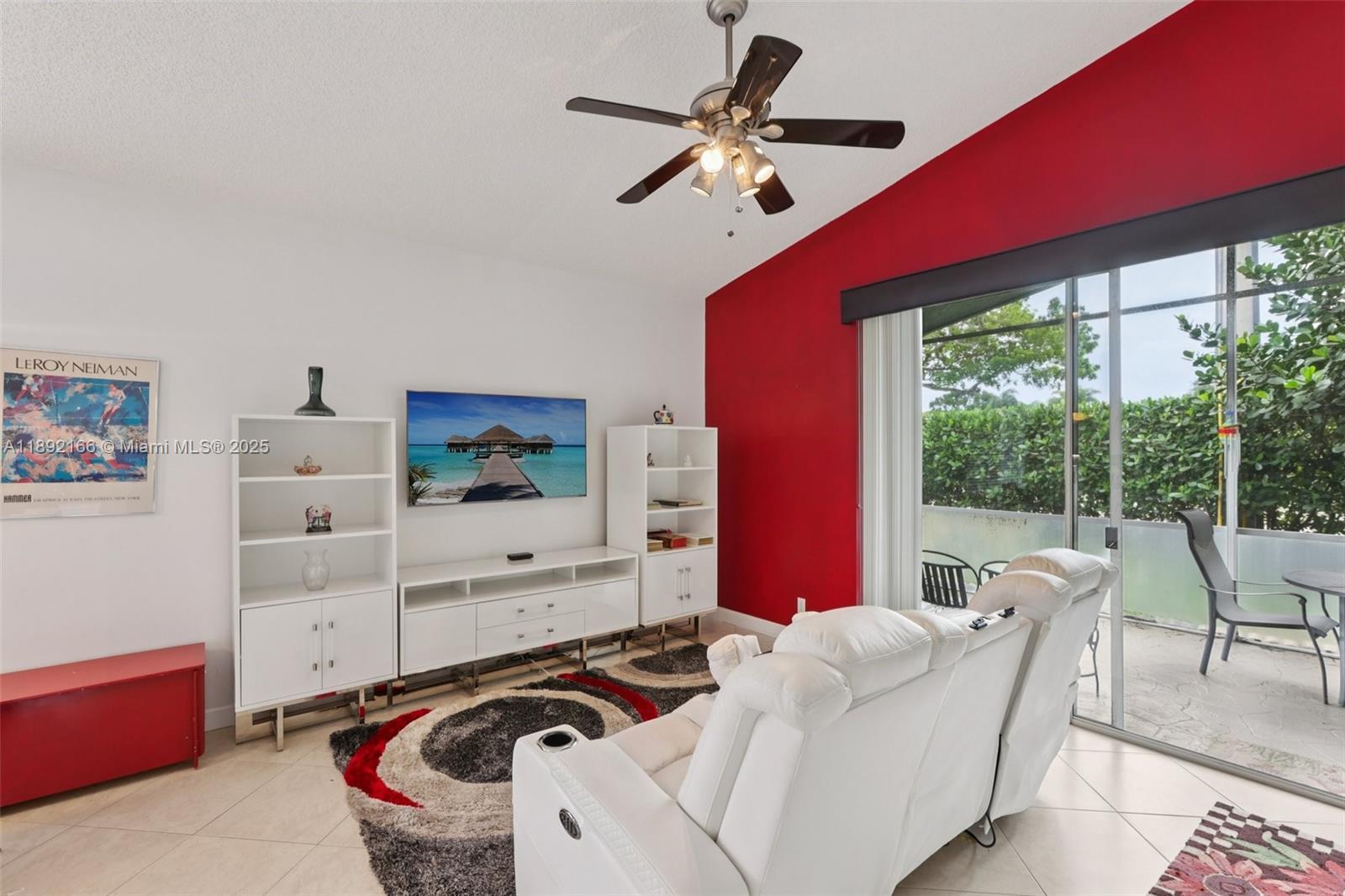 8752 Northwest 75th Court Tamarac, FL 33321 - Photo 3 of 26 a room with furniture and a window