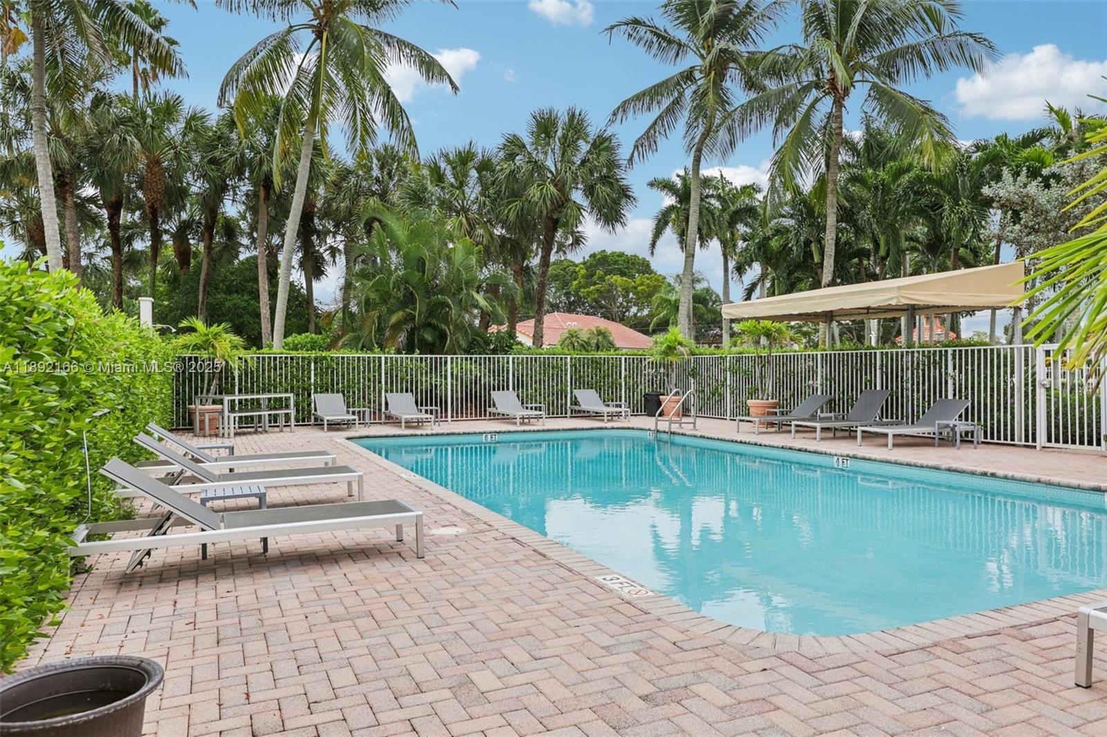 8752 Northwest 75th Court Tamarac, FL 33321 - Photo 5 of 26 a view of swimming pool with chairs
