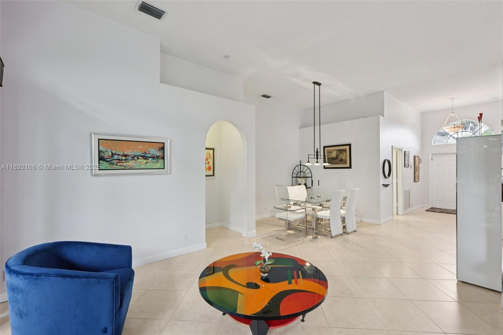 8752 Northwest 75th Court Tamarac, FL 33321 - Photo 7 of 26 a living room with furniture and a wooden floor
