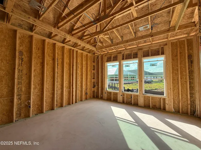 a view of an empty room with wooden walls