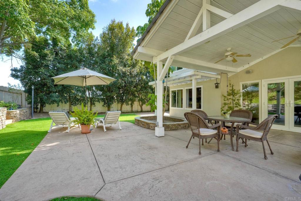 13639 Freeport Road San Diego, CA 92129 - Photo 27 of 44 a view of a house with backyard porch and sitting area