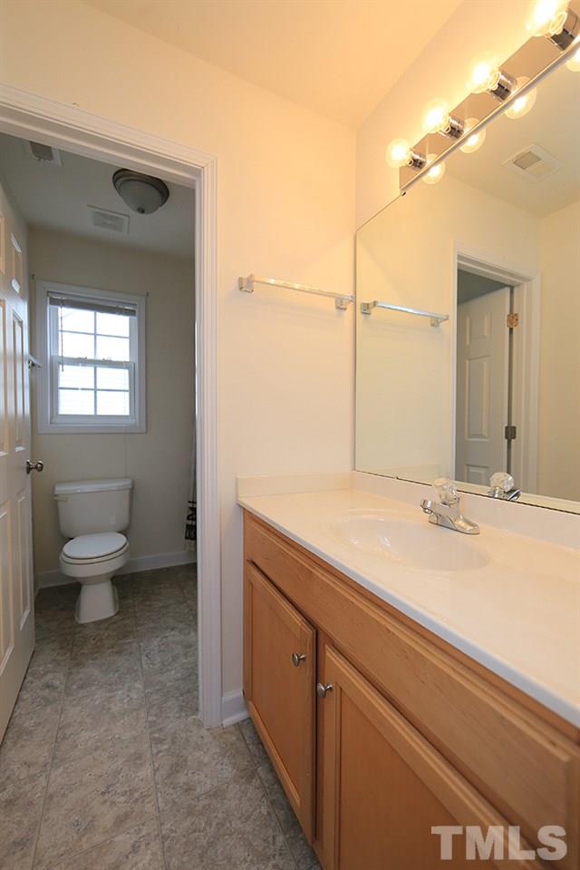 6020 Brambleberry Way Raleigh, NC 27616 - Photo 10 of 14 Hall bathroom has tub/shower.