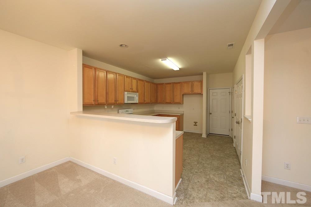 6020 Brambleberry Way Raleigh, NC 27616 - Photo 3 of 14 Dining room opens to kitchen.