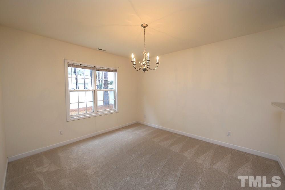 6020 Brambleberry Way Raleigh, NC 27616 - Photo 4 of 14 Dining Room features large window looking onto back yard.