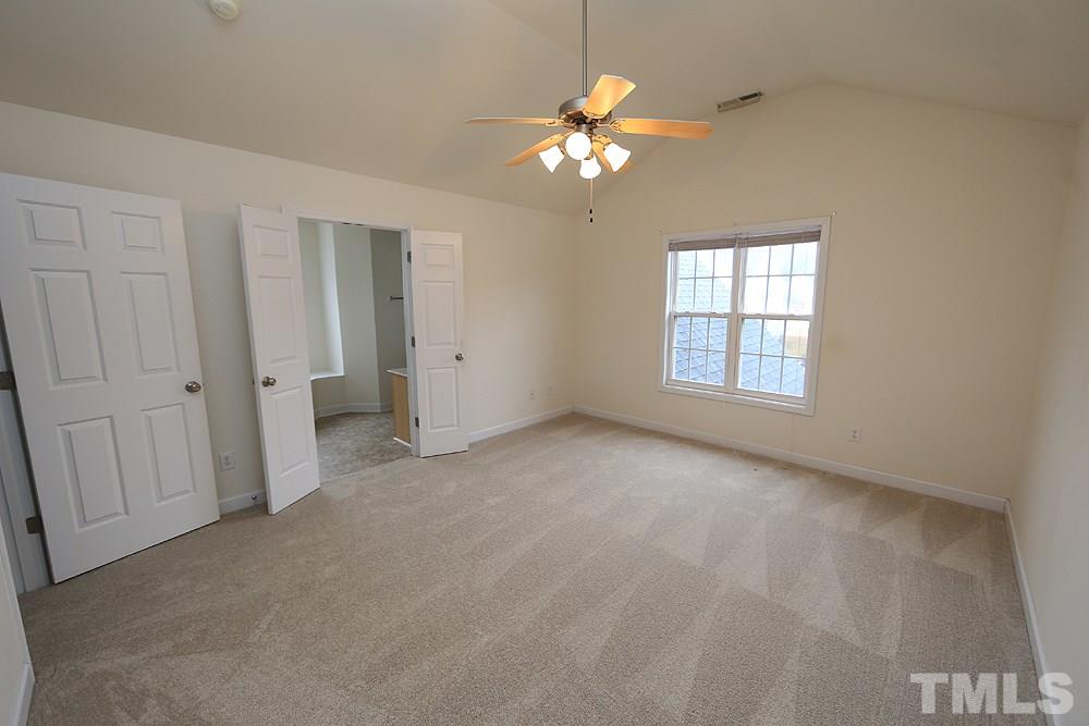 6020 Brambleberry Way Raleigh, NC 27616 - Photo 6 of 14 Master bedroom features a cathedral ceiling and with large walk-in closet and master bath.