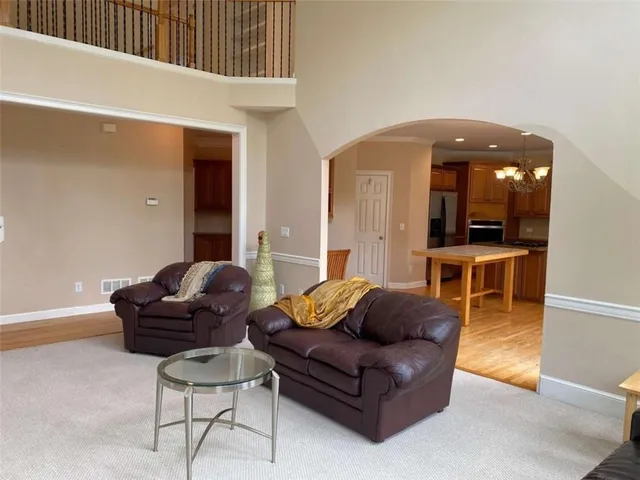 a living room with a fireplace and a flat screen tv
