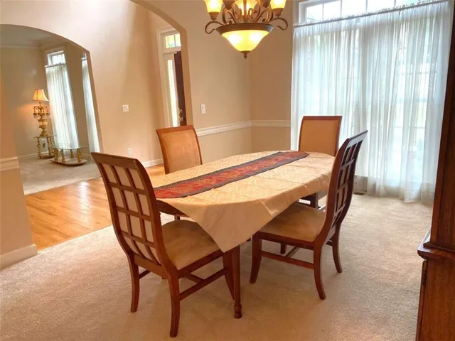 a bathroom with a bathtub a sink and a window