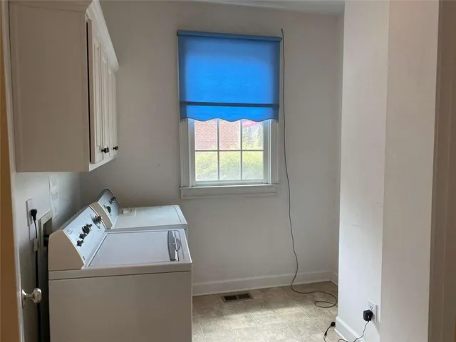 an aerial view of a house with yard swimming pool and outdoor seating