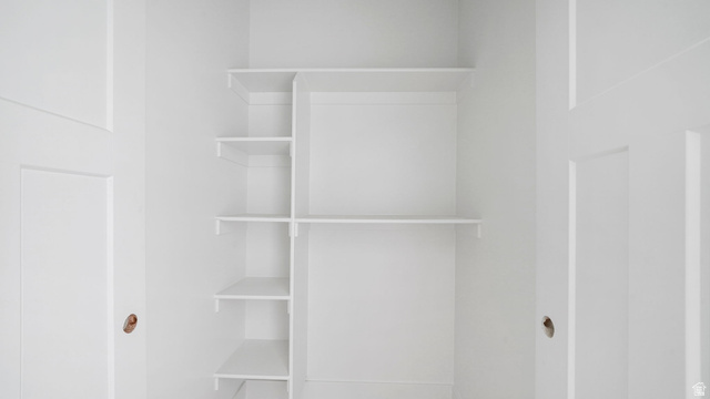 717 South Harrison Drive West Springville, UT 84663 - Photo 18 of 31 White closet interior with integrated shelving and hanging rod