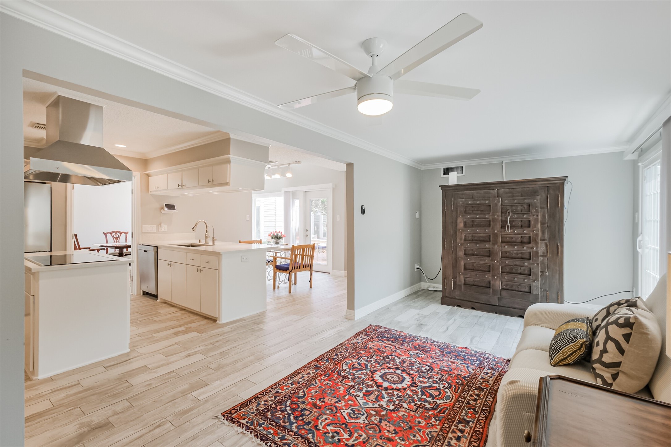 1007 Arrow Hill Road Houston, TX 77077 - Photo 18 of 48 The den is just off to the side of the island kitchen with tile wood floors, crown molding, tall ceilings and a updated ceiling fan.