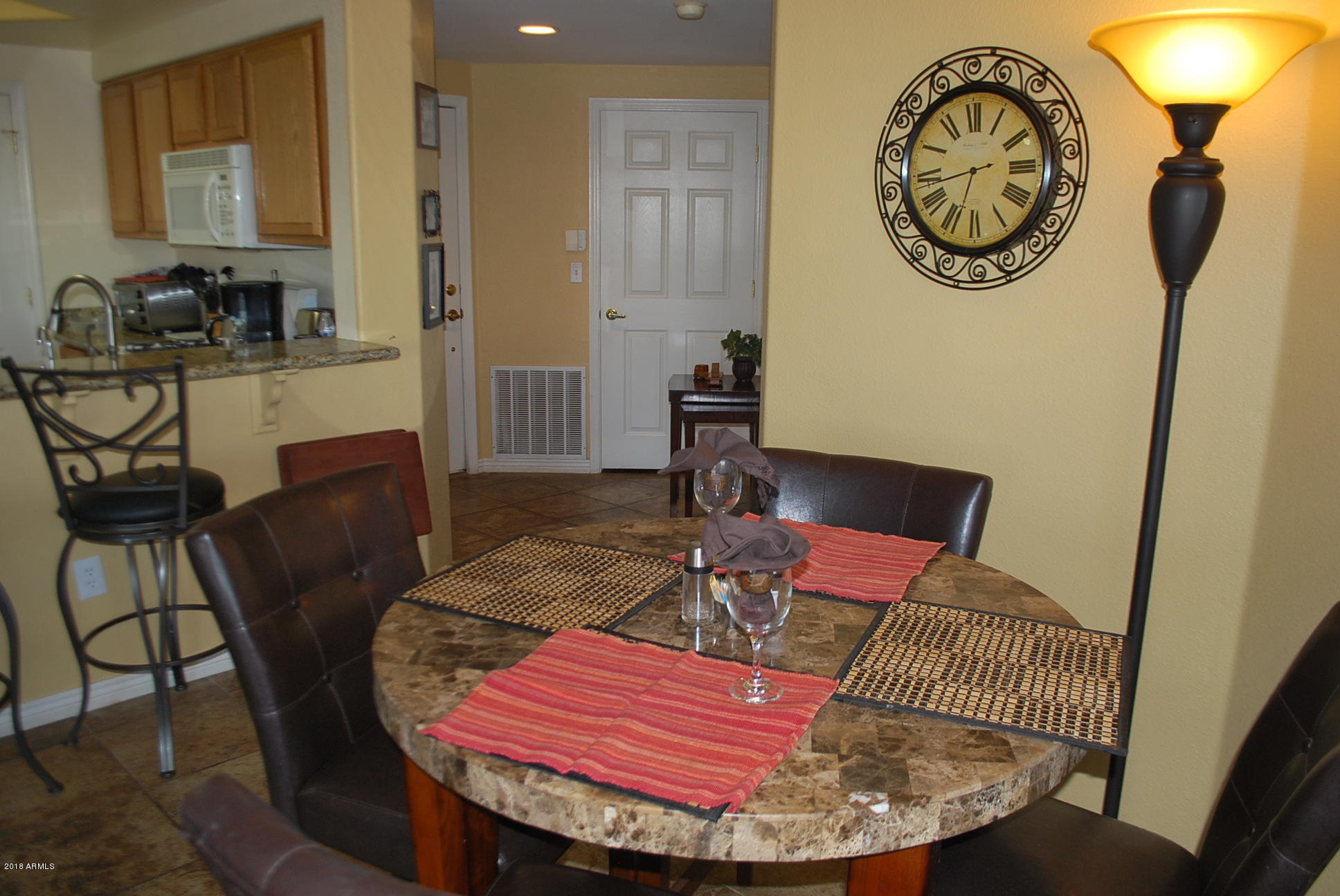 10030 West Indian School Road, Unit 158 Phoenix, AZ 85037 - Photo 12 of 28 a view of a dining room with furniture
