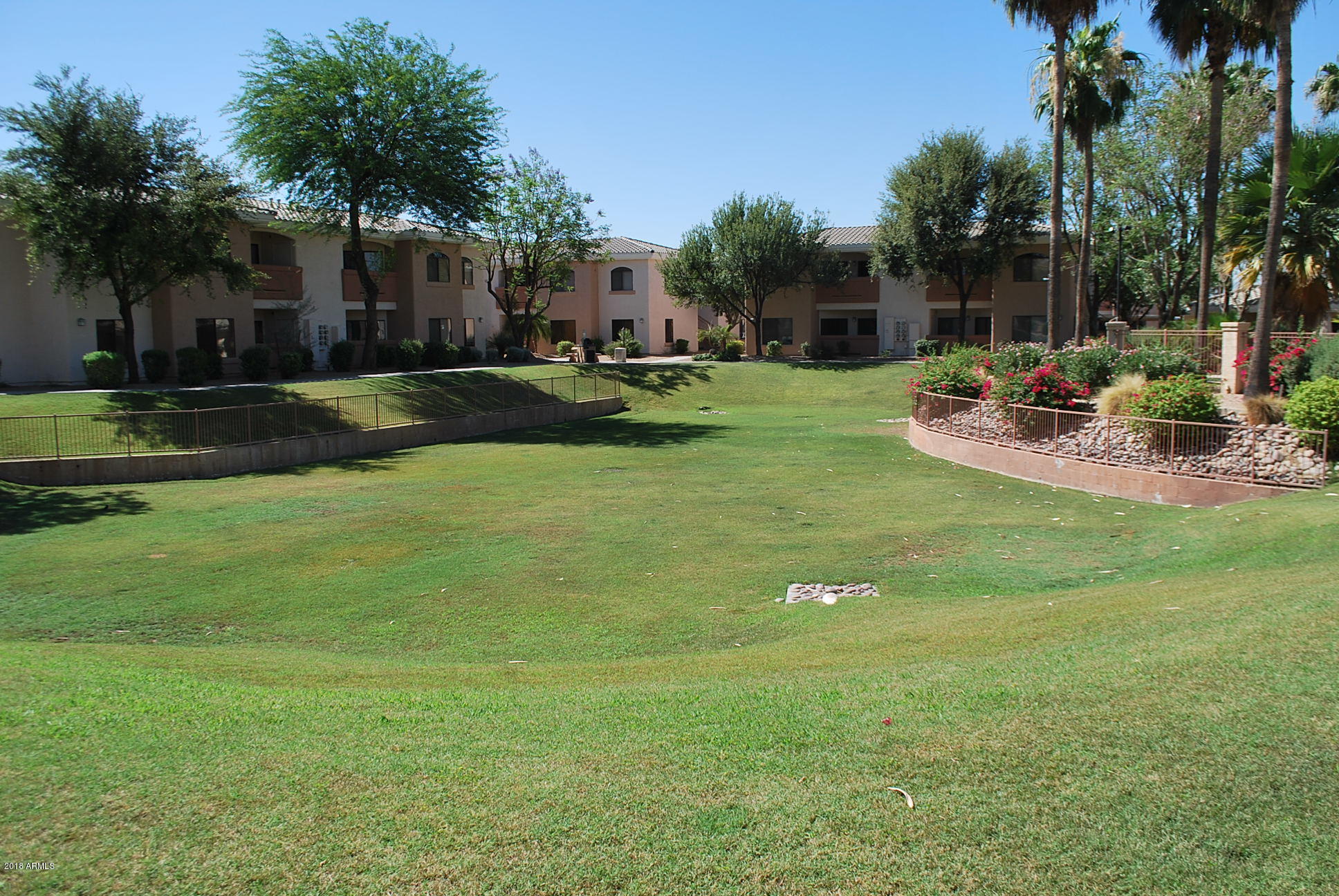 10030 West Indian School Road, Unit 158 Phoenix, AZ 85037 - Photo 28 of 28 a view of a house with a yard