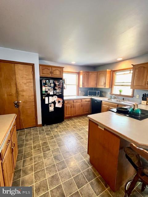 328 Red Pump Road Nottingham, PA 19362 - Photo 11 of 37 a kitchen with stainless steel appliances a refrigerator sink and cabinets