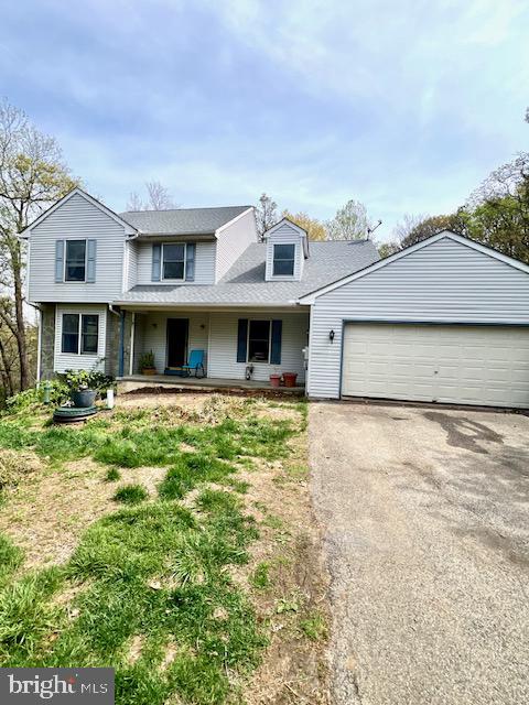 328 Red Pump Road Nottingham, PA 19362 - Photo 2 of 37 a front view of a house with a garden