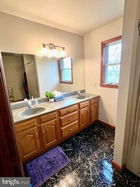 328 Red Pump Road Nottingham, PA 19362 - Photo 21 of 37 a bathroom with a sink and a mirror