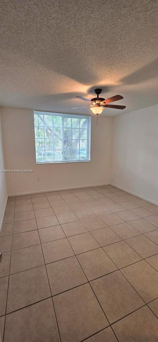 2173 Renaissance Boulevard, Unit 103 Miramar, FL 33025 - Photo 17 of 36 a view of an empty room with a window