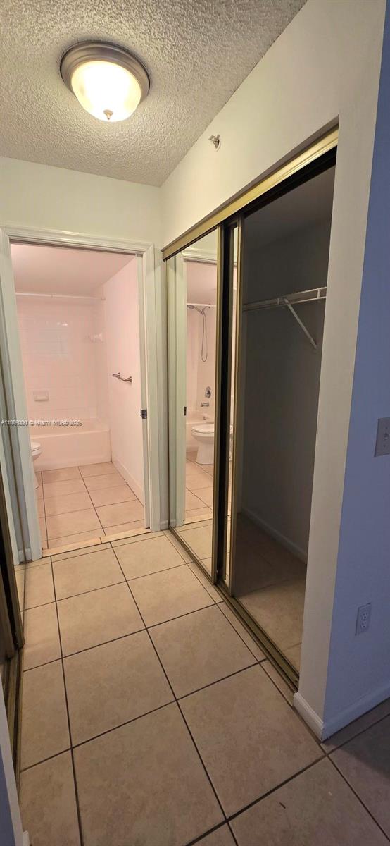 2173 Renaissance Boulevard, Unit 103 Miramar, FL 33025 - Photo 18 of 36 an empty room with mirror and shower