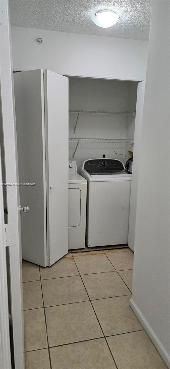 2173 Renaissance Boulevard, Unit 103 Miramar, FL 33025 - Photo 25 of 36 a utility room with washing machine