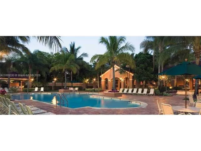 a view of a swimming pool with a lounge chairs