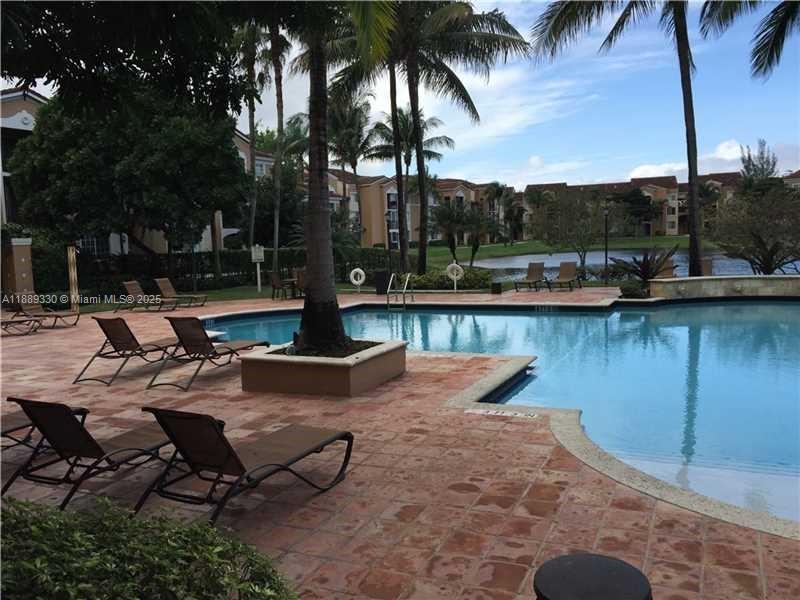 2173 Renaissance Boulevard, Unit 103 Miramar, FL 33025 - Photo 29 of 36 a view of a lake with a sitting area