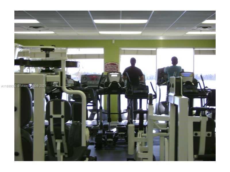 2173 Renaissance Boulevard, Unit 103 Miramar, FL 33025 - Photo 32 of 36 a view of a room with lots of frames on wall
